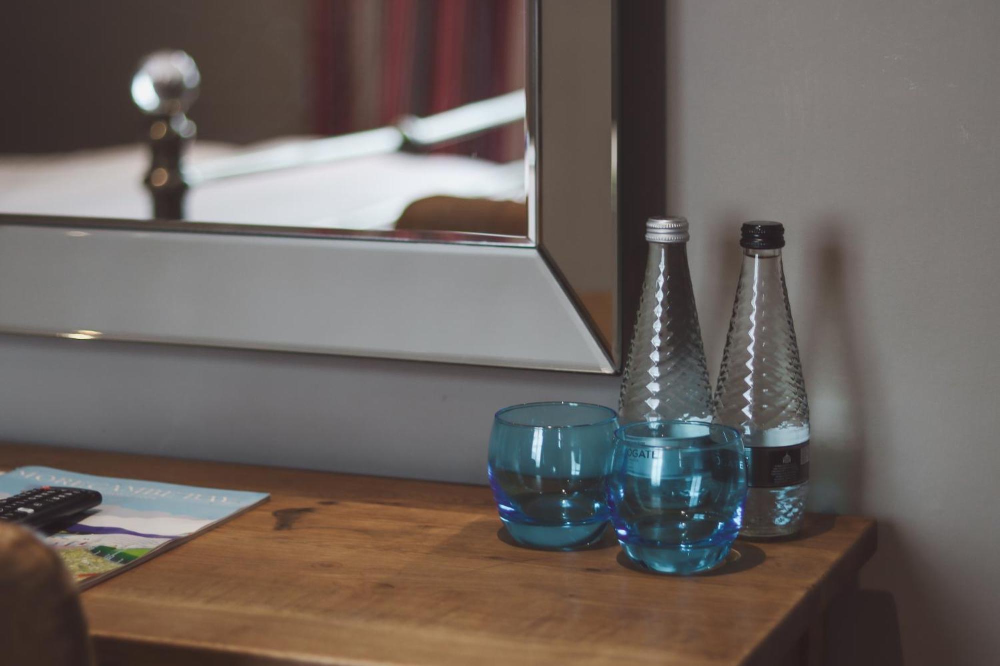 Longlands Inn & Cottages Carnforth Exterior foto Bottled water in a hotel room